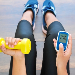 Adult exercising with a dumbbell as part of an active daily wellness routine